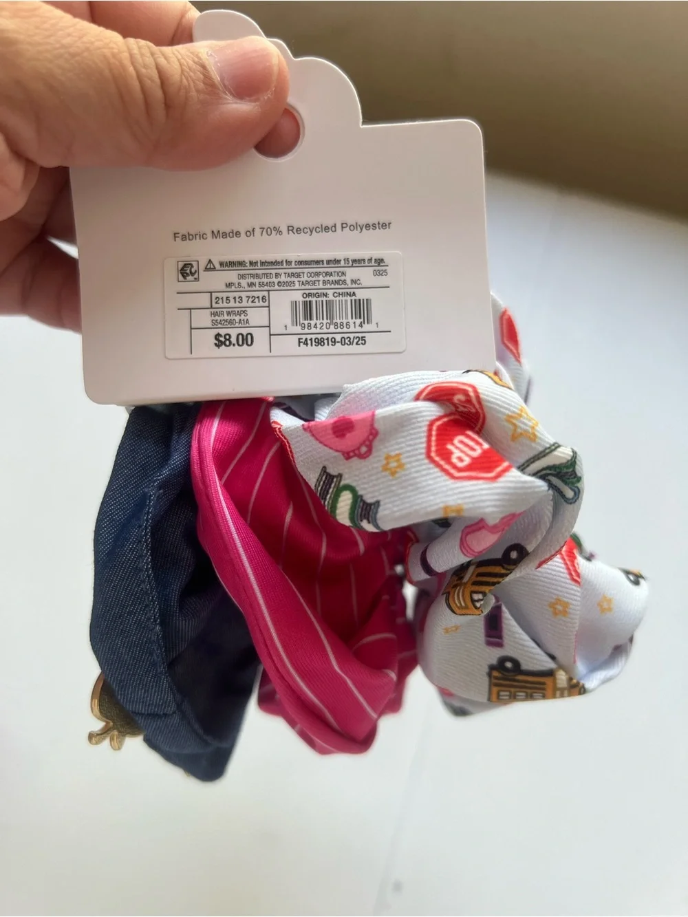 This is a 3-pack of themed hair scrunchies designed with school-related motifs.